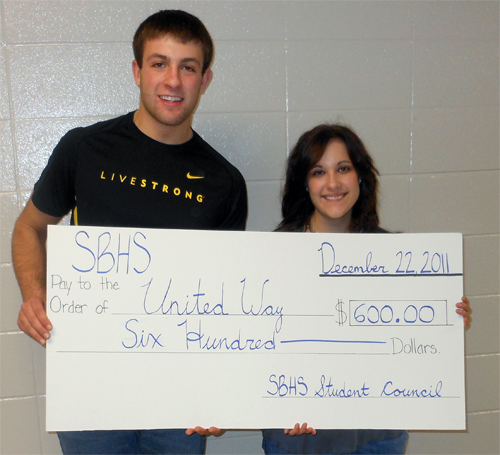 David Tauber Jr. and Rebecca Fredrickson with a check for $600 for United Way