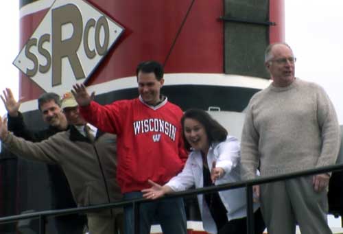  Bob Desh, Executive Director of the Door County Maritime Museum leads Wisconsin Governor Scott Walker and  Wisconsin Department of Tourism Secretary Stephanie Klett on a tour of the historical Tug John Purves.